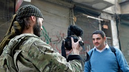 Matthew VanDyke fotografiert einen syrischen Rebellen in Aleppo.  